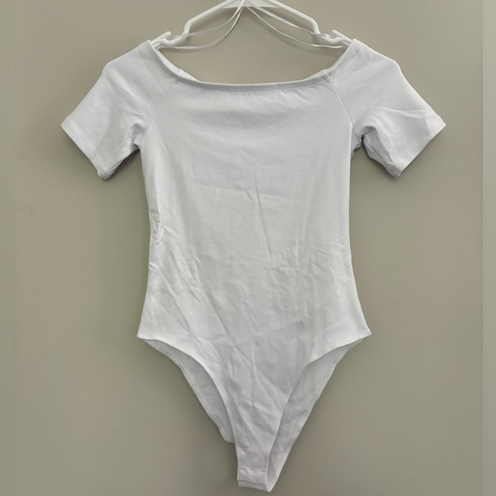 White ZARA Bodysuit with a Scoop Neckline and Short Sleeves.